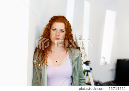 Young female artist with her picture 33713231