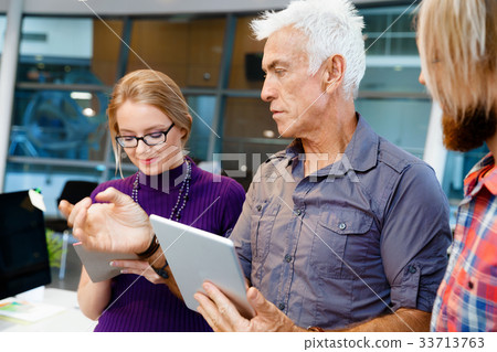 Handsome businessman in office Handsome businessman in office 33713763