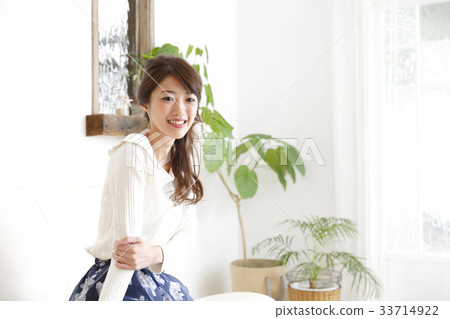 A woman relaxing in the room 33714922