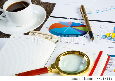 Financial charts and graphs on the table Financial charts and graphs on the table 33715114
