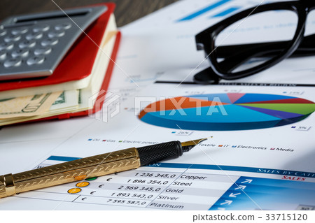 Financial charts and graphs on the table Financial charts and graphs on the table 33715120