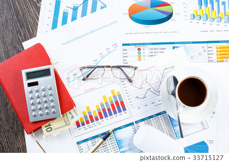 Financial charts and graphs on the table Financial charts and graphs on the table 33715127