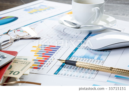 Financial charts and graphs on the table Financial charts and graphs on the table 33715151