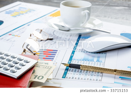 Financial charts and graphs on the table Financial charts and graphs on the table 33715153