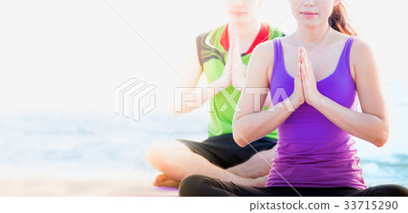 female master yoga doing namaste pose 33715290