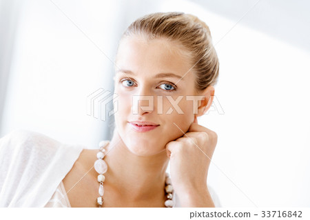 Attractive office worker sitting at desk Attractive office worker sitting at desk 33716842