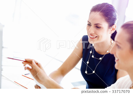 Two female colleagues in office 33717070