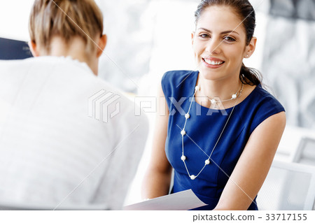 Two female colleagues in office Two female colleagues in office 33717155