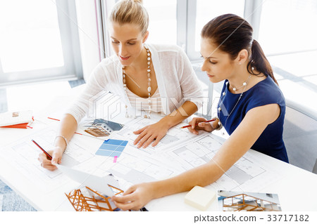 Two female colleagues in office 33717182