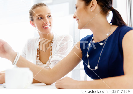 Two female colleagues in office 33717199