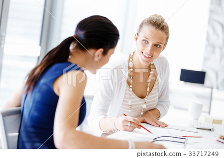 Two female colleagues in office 33717249