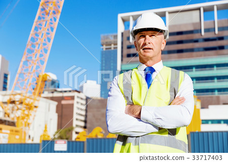 Engineer builder at construction site 33717403