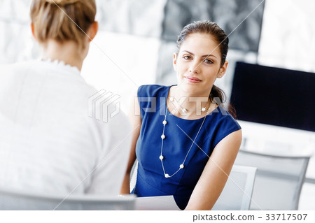 Two female colleagues in office 33717507
