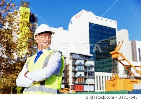 Engineer builder at construction site 33717643