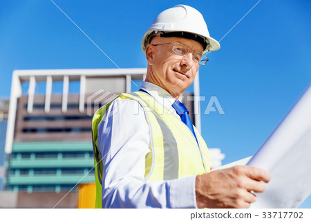 Engineer builder at construction site Engineer builder at construction site 33717702