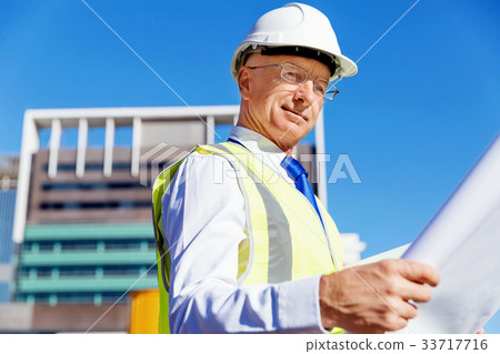 Engineer builder at construction site Engineer builder at construction site 33717716