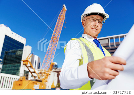 Engineer builder at construction site 33717738