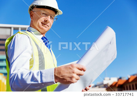Engineer builder at construction site 33717741