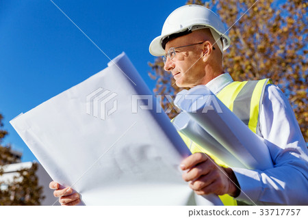 Engineer builder at construction site Engineer builder at construction site 33717757
