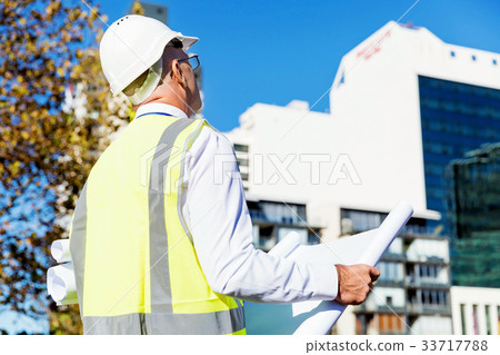 Engineer builder at construction site 33717788