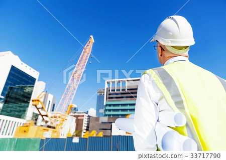 Engineer builder at construction site 33717790