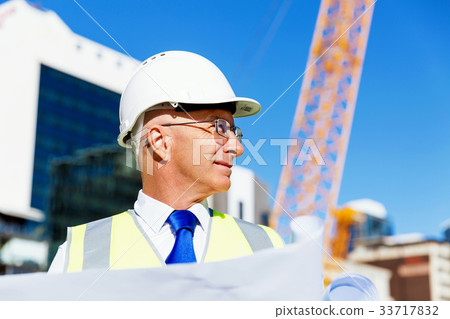 Engineer builder at construction site 33717832