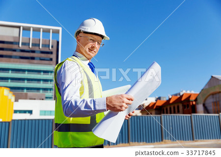 Engineer builder at construction site 33717845