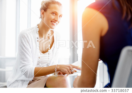 Two female colleagues in office 33718037