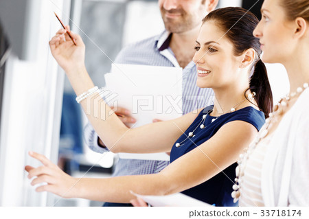 Business people in modern office Business people in modern office 33718174