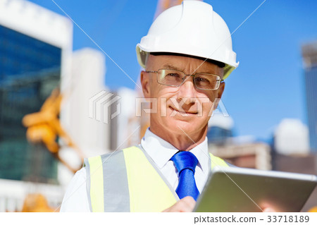 Engineer builder at construction site Engineer builder at construction site 33718189