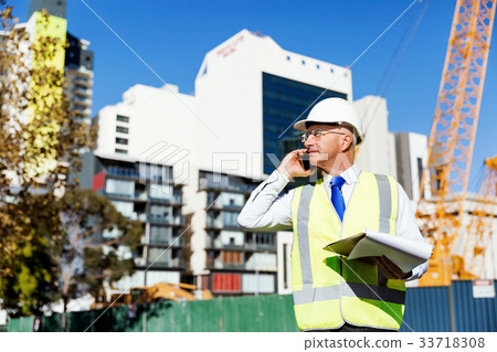 Engineer builder at construction site 33718308