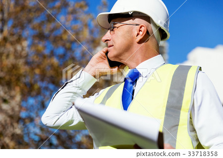 Engineer builder at construction site Engineer builder at construction site 33718358