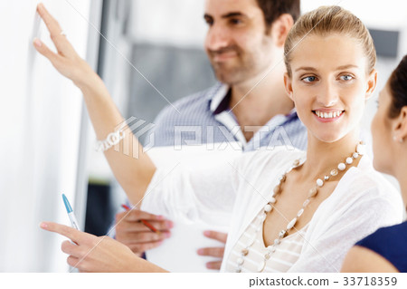 Business people in modern office Business people in modern office 33718359