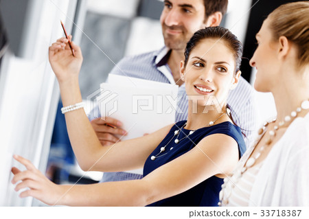 Business people in modern office Business people in modern office 33718387