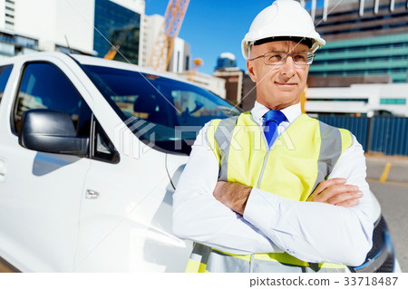 Engineer builder at construction site 33718487