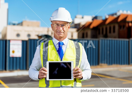 Engineer builder at construction site 33718500