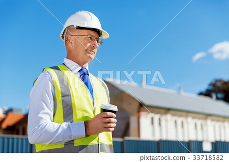 Engineer builder at construction site 33718582