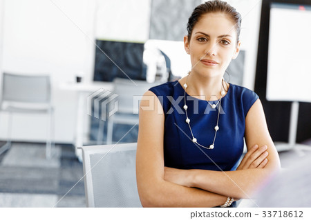 Businesswoman working in office 33718612