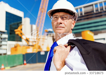 Businessman at construction site 33718673