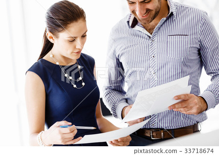 Business people in modern office Business people in modern office 33718674