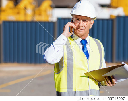 Engineer builder at construction site 33718907
