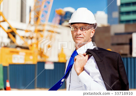 Businessman at construction site Businessman at construction site 33718910