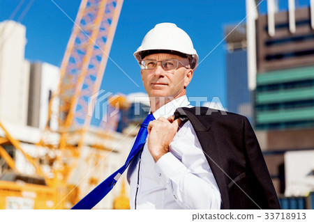 Businessman at construction site Businessman at construction site 33718913