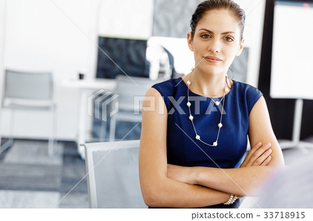 Businesswoman working in office Businesswoman working in office 33718915