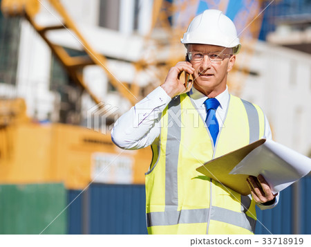 Engineer builder at construction site Engineer builder at construction site 33718919