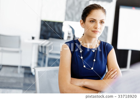 Businesswoman working in office Businesswoman working in office 33718920