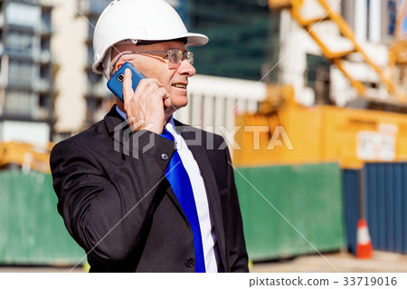 Businessman at construction site 33719016