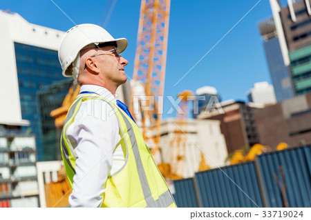 Engineer builder at construction site 33719024
