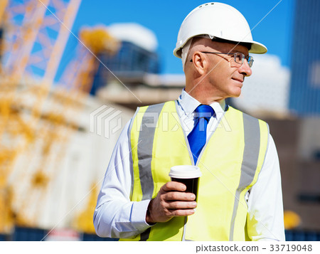Engineer builder at construction site 33719048