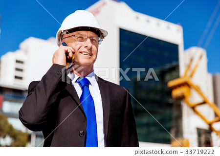 Businessman at construction site 33719222